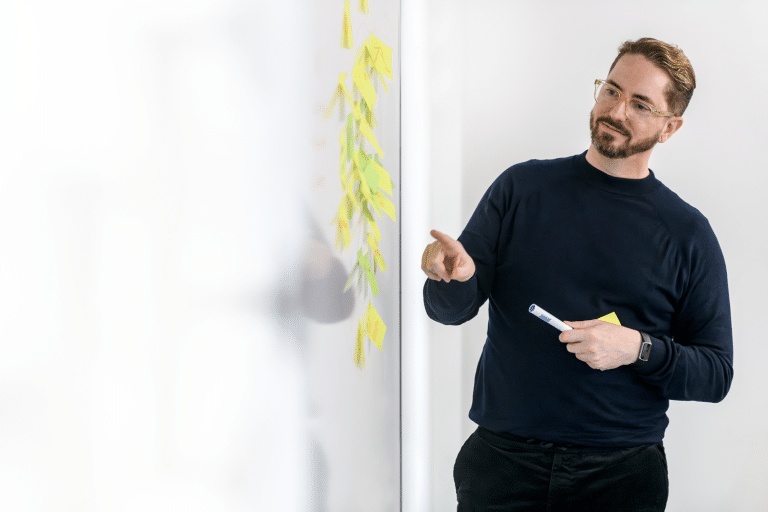 Culture consultant with whiteboard and sticker notes